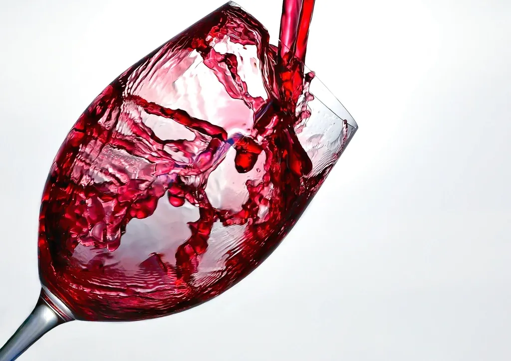 Pouring red wine glass image